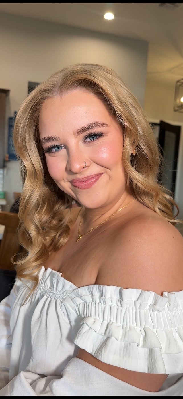 Blonde bride in off-shoulder gown — glowing natural bridal makeup